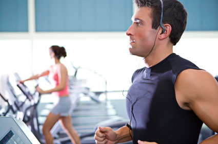 Man running on a tredmill in a sport club